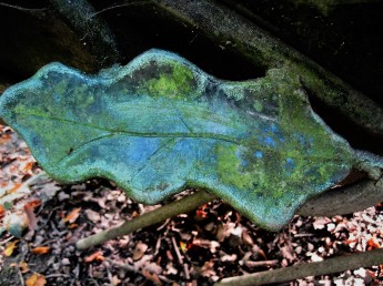 A sculpted leaf adorns a bench